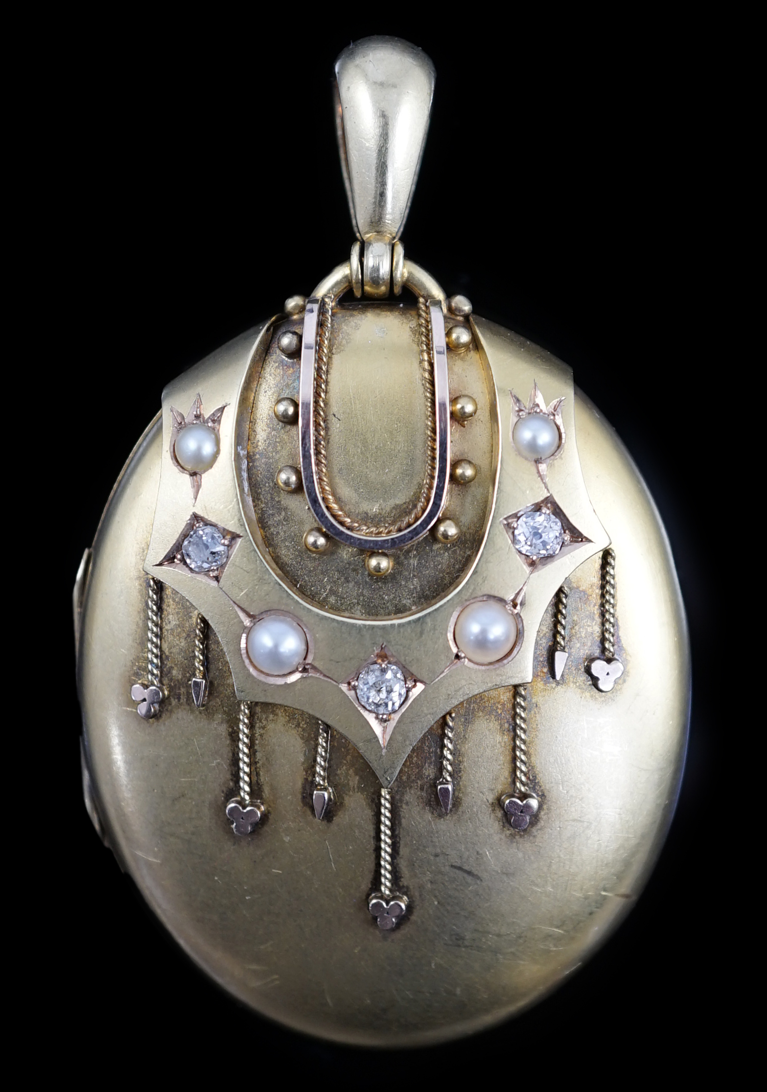 A Victorian gold, diamond and split pearl set oval locket